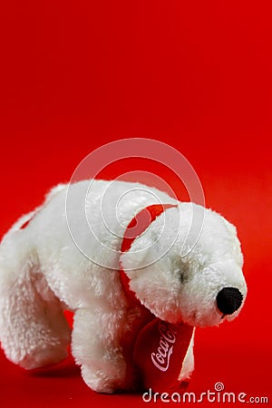 Atlanta, Georgia, USA April 1, 2020: souvenir polar bear Coca-Cola closeup isolated on red background Editorial Stock Photo